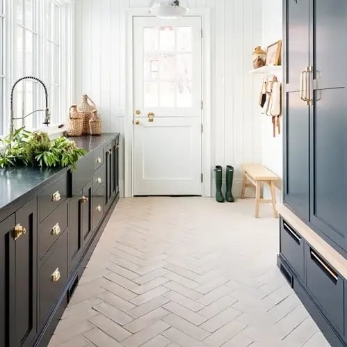 studio-mcgee-mudroom-cropped-rustic-cement-tile-herringbone-floor